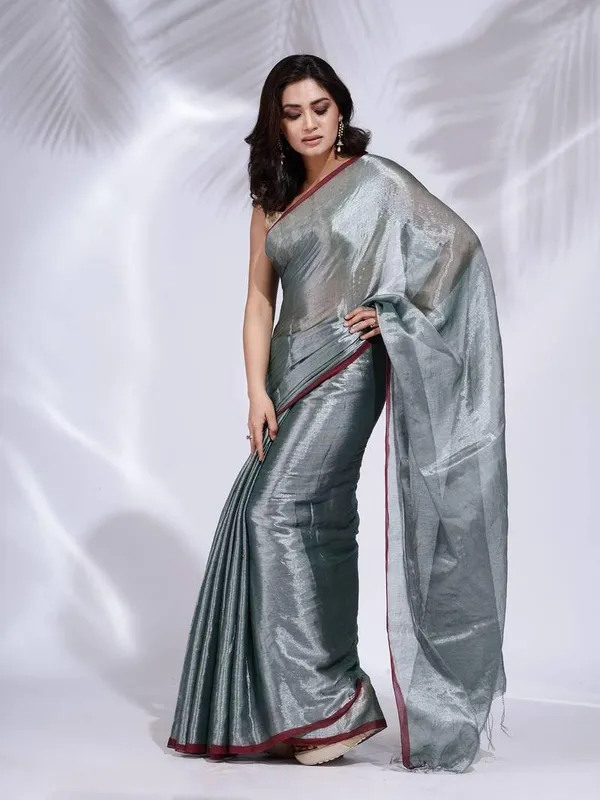 Grey_Handloom_Glossy_Tissue_Saree_With_Rich_Red_Border_Soft,_Lightweight_&_Lustrous_Finish_Perfect_For_Weddings,_Traditional_Elegance_Artisanal_Weaving_Masterpiece_For_Women