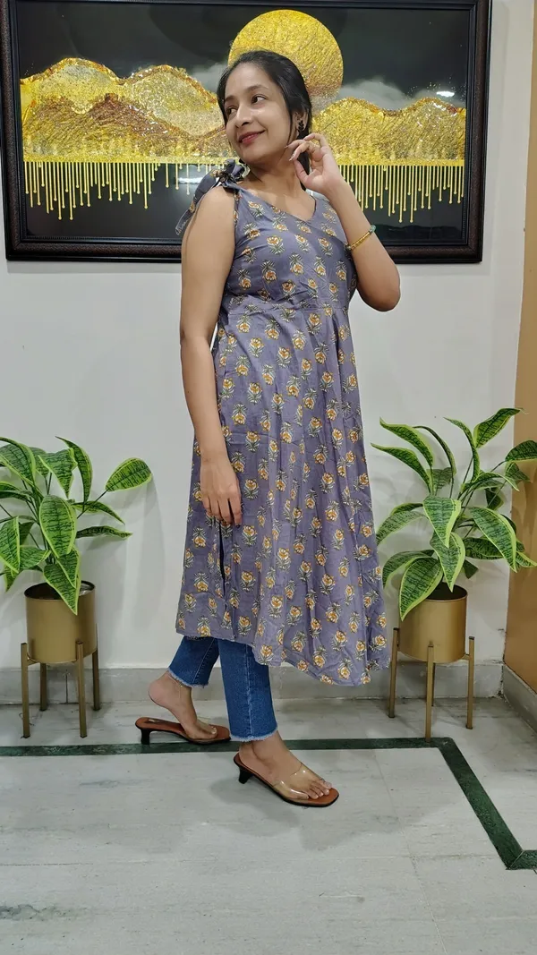 Cyan_Light_Floral-Print_Cotton_Sleeveless_Kurta_With_One-Side_Bow_Sleeve_And_Umbrella_Flare_For_Women
