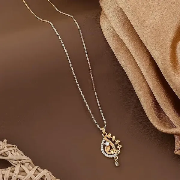Gold_Plated_Pendant_Necklace_With_Intricate_Design_And_Gemstone_Accents_Pearl_Metal_Pendant