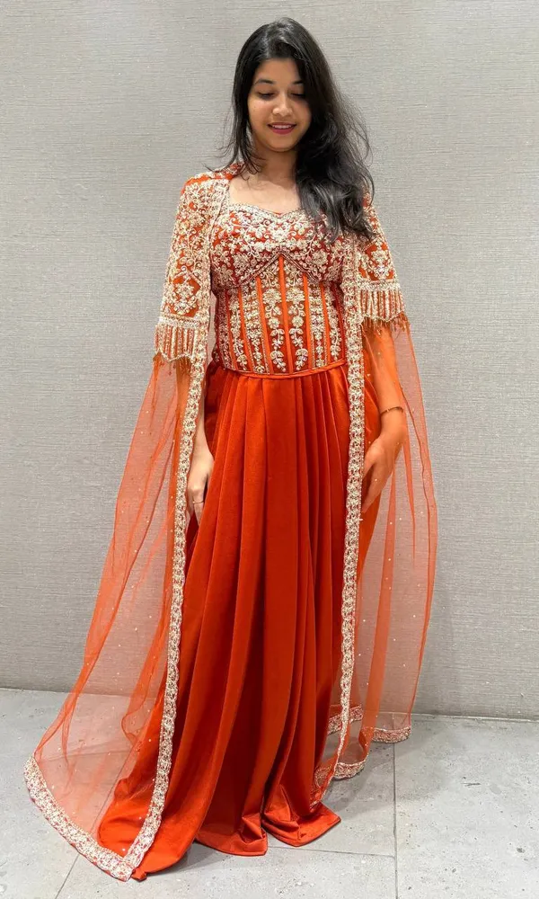 Orange_Premium_Roman_Silk_Western_Dhoti_Set_With_Net_Shrug_For_Women