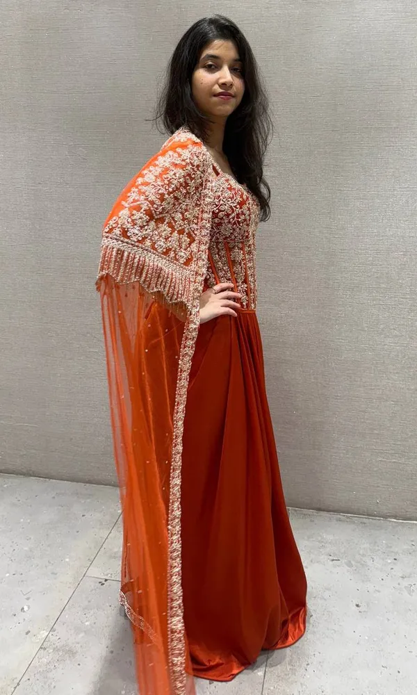 Orange_Premium_Roman_Silk_Western_Dhoti_Set_With_Net_Shrug_For_Women