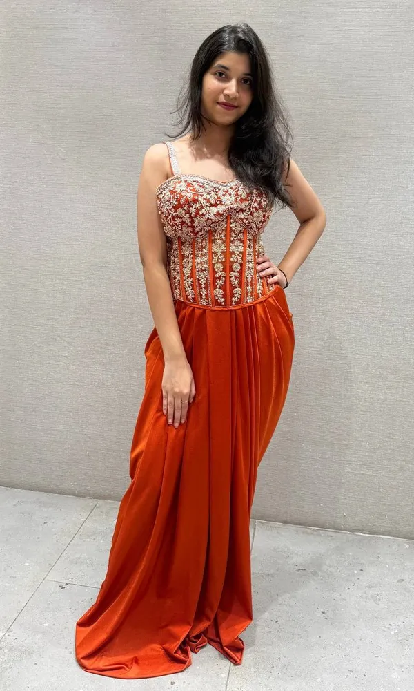 Orange_Premium_Roman_Silk_Western_Dhoti_Set_With_Net_Shrug_For_Women