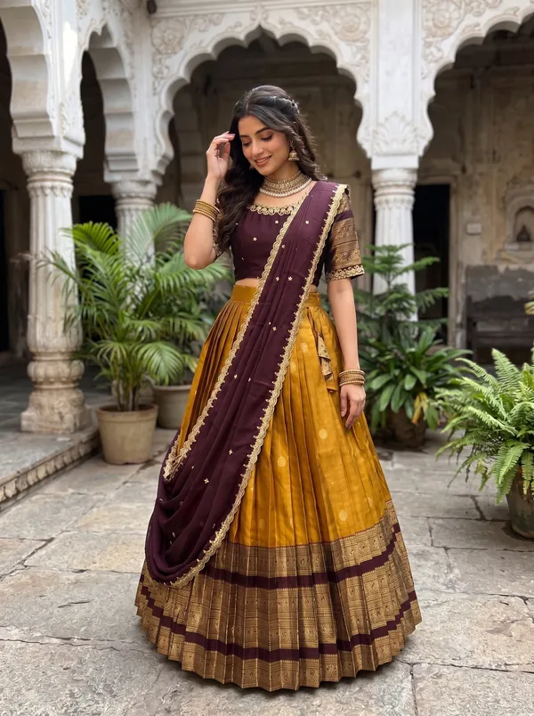 Traditional_yellow_and_megenta_Silk_Half_Saree_with_Zari_Woven_Border