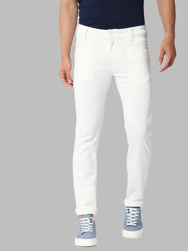 White_Cotton_Blend_Slim_Mid_Rise_Jeans_For_Men