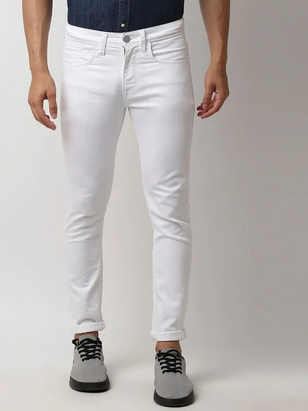 White_Cotton_Blend_Slim_Mid_Rise_Jeans_For_Men