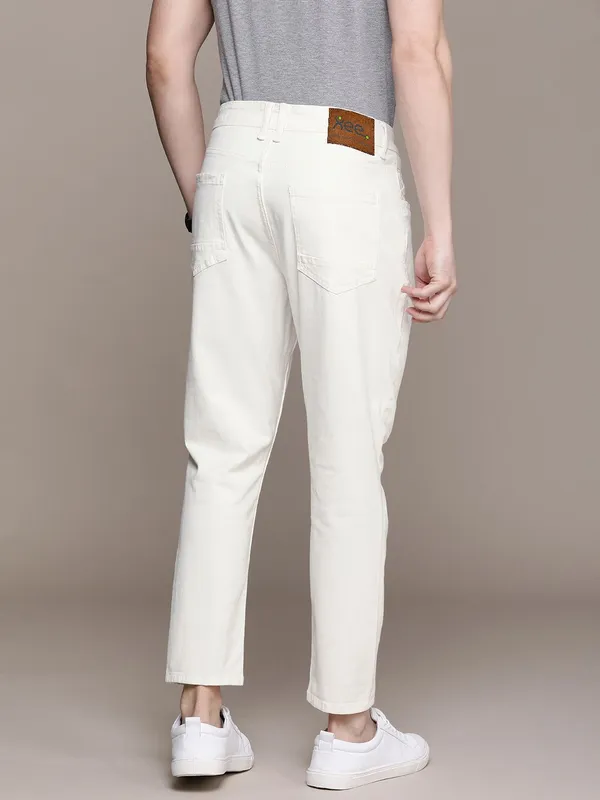 White_Cotton_Blend_Slim_Mid_Rise_Jeans_For_Men