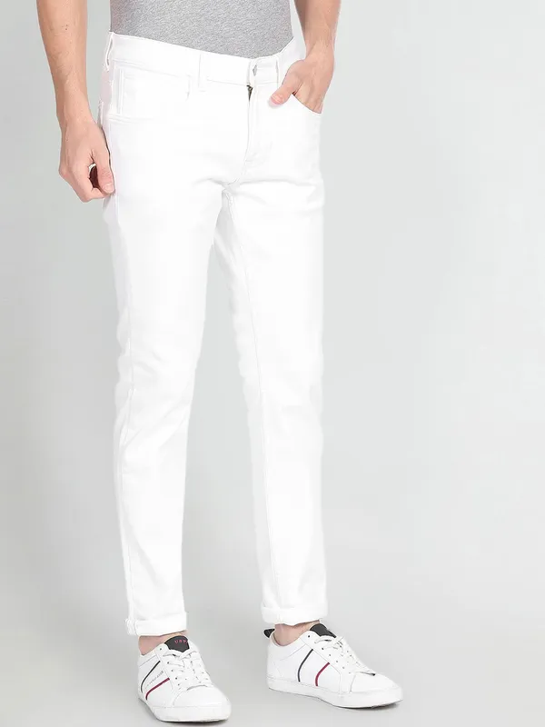 White_Cotton_Blend_Slim_Mid_Rise_Jeans_For_Men