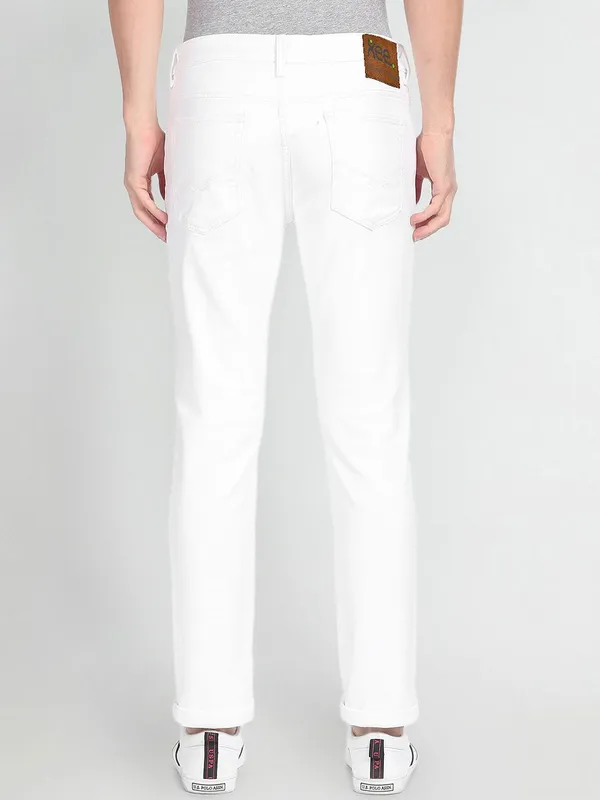 White_Cotton_Blend_Slim_Mid_Rise_Jeans_For_Men
