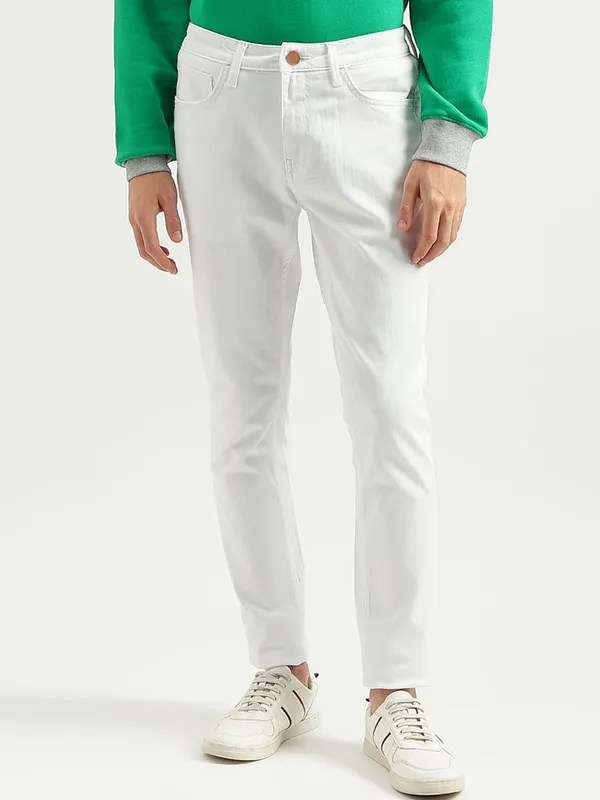 White_Cotton_Blend_Slim_Mid_Rise_Jeans_For_Men