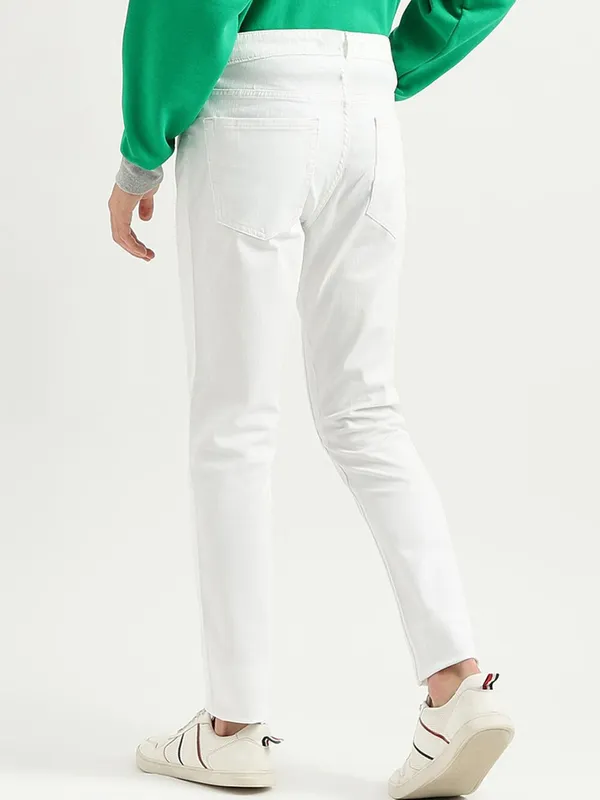 White_Cotton_Blend_Slim_Mid_Rise_Jeans_For_Men