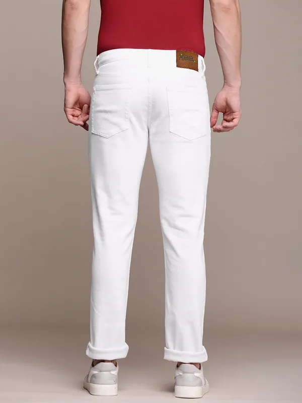 White_Cotton_Blend_Slim_Mid_Rise_Jeans_For_Men