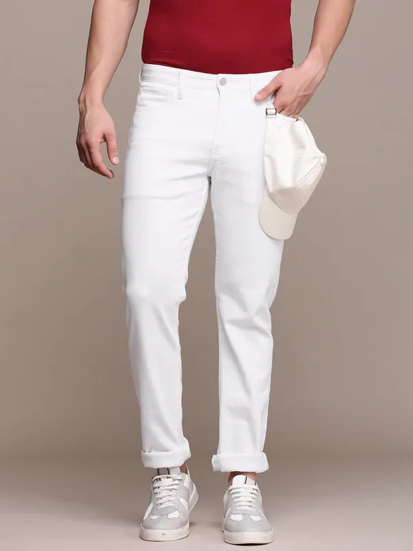 White_Cotton_Blend_Slim_Mid_Rise_Jeans_For_Men