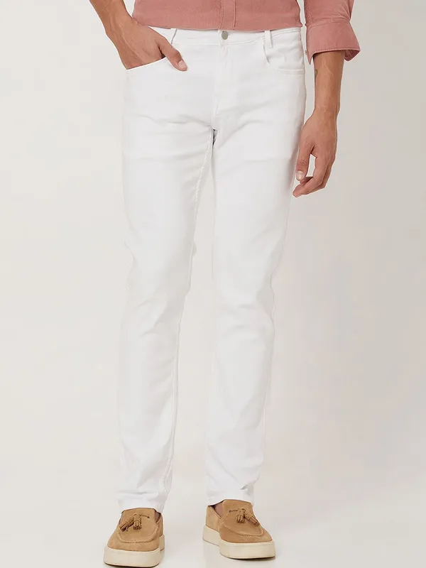 White_Cotton_Blend_Slim_Mid_Rise_Jeans_For_Men