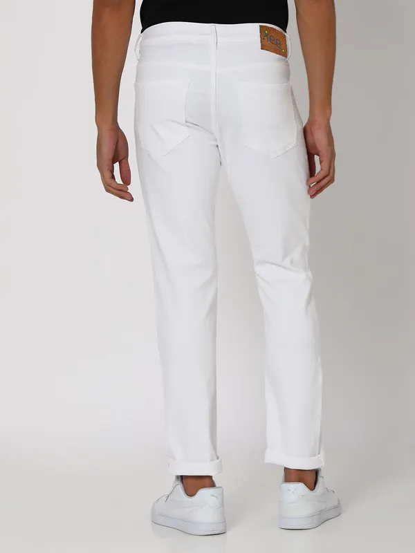 White_Cotton_Blend_Slim_Mid_Rise_Jeans_For_Men