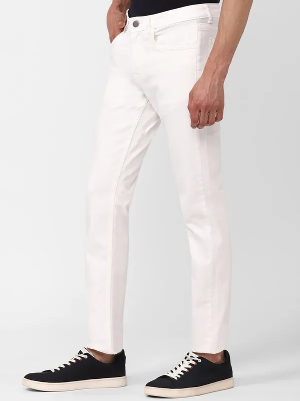 White_Cotton_Blend_Slim_Mid_Rise_Jeans_For_Men