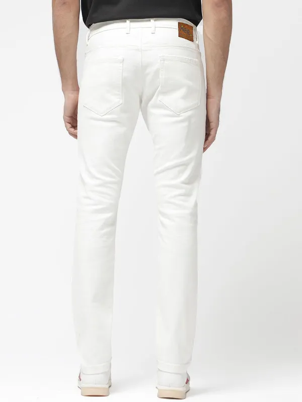 White_Cotton_Blend_Slim_Mid_Rise_Jeans_For_Men