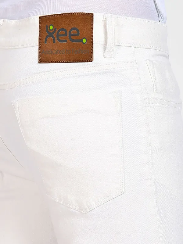 White_Cotton_Blend_Slim_Mid_Rise_Jeans_For_Men