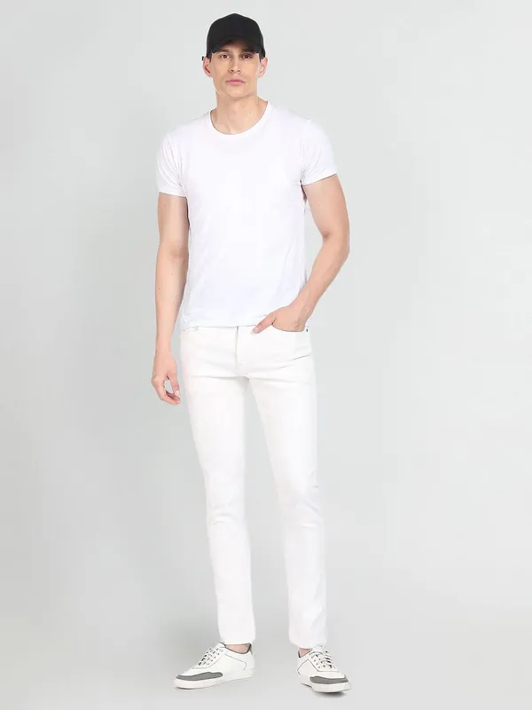 White_Cotton_Blend_Slim_Mid_Rise_Jeans_For_Men