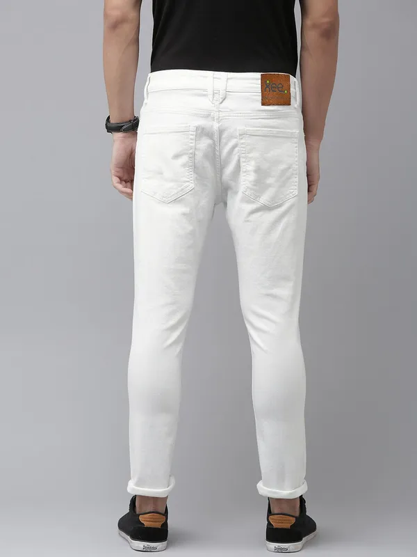 White_Cotton_Blend_Slim_Mid_Rise_Jeans_For_Men