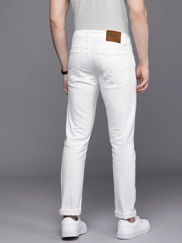 White_Cotton_Blend_Slim_Mid_Rise_Jeans_For_Men