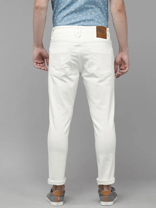 White_Cotton_Blend_Slim_Mid_Rise_Jeans_For_Men