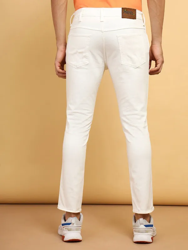 White_Cotton_Blend_Slim_Mid_Rise_Jeans_For_Men