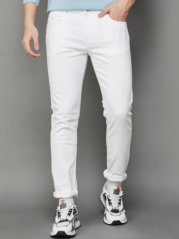White_Cotton_Blend_Slim_Mid_Rise_Jeans_For_Men