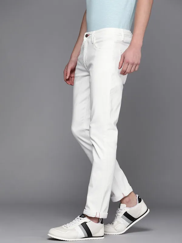 White_Cotton_Blend_Slim_Mid_Rise_Jeans_For_Men