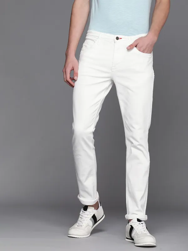 White_Cotton_Blend_Slim_Mid_Rise_Jeans_For_Men