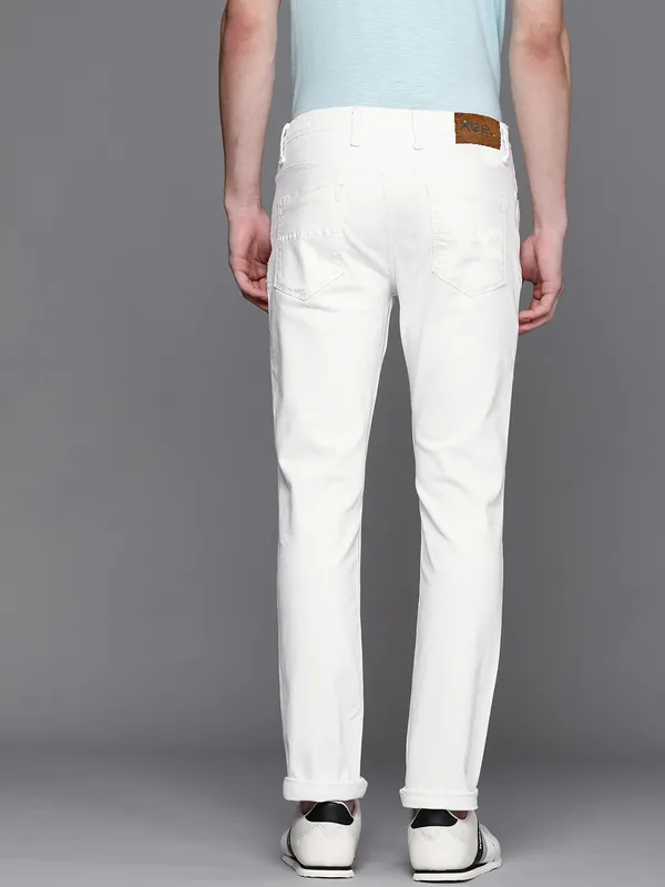 White_Cotton_Blend_Slim_Mid_Rise_Jeans_For_Men