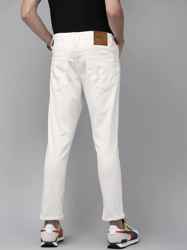 White_Cotton_Blend_Slim_Mid_Rise_Jeans_For_Men