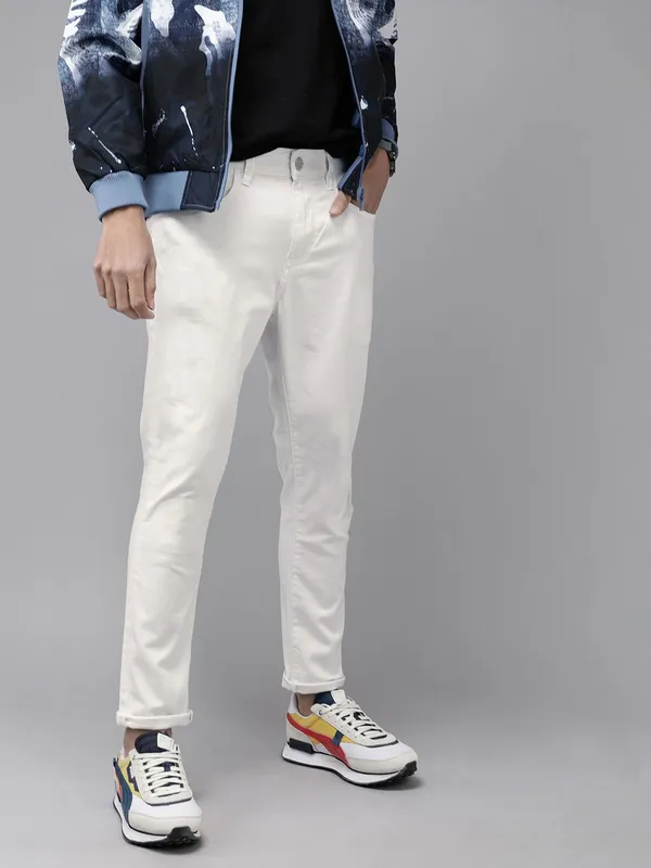 White_Cotton_Blend_Slim_Mid_Rise_Jeans_For_Men