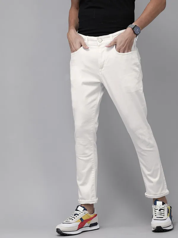 White_Cotton_Blend_Slim_Mid_Rise_Jeans_For_Men