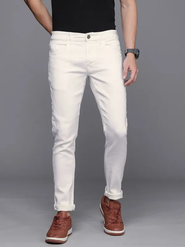 White_Cotton_Blend_Slim_Mid_Rise_Jeans_For_Men
