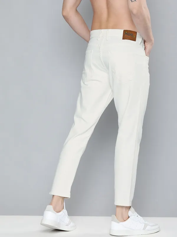 White_Cotton_Blend_Slim_Mid_Rise_Jeans_For_Men