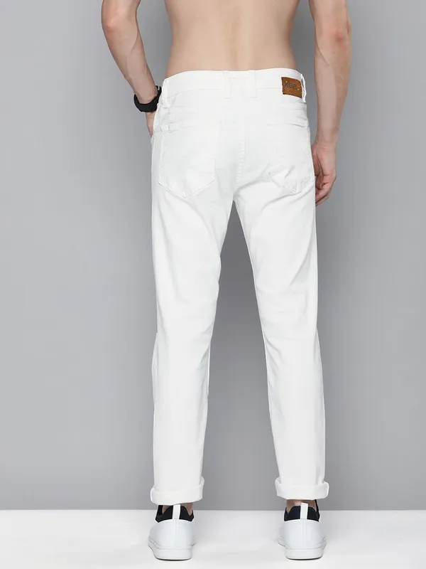 White_Cotton_Blend_Slim_Mid_Rise_Jeans_For_Men