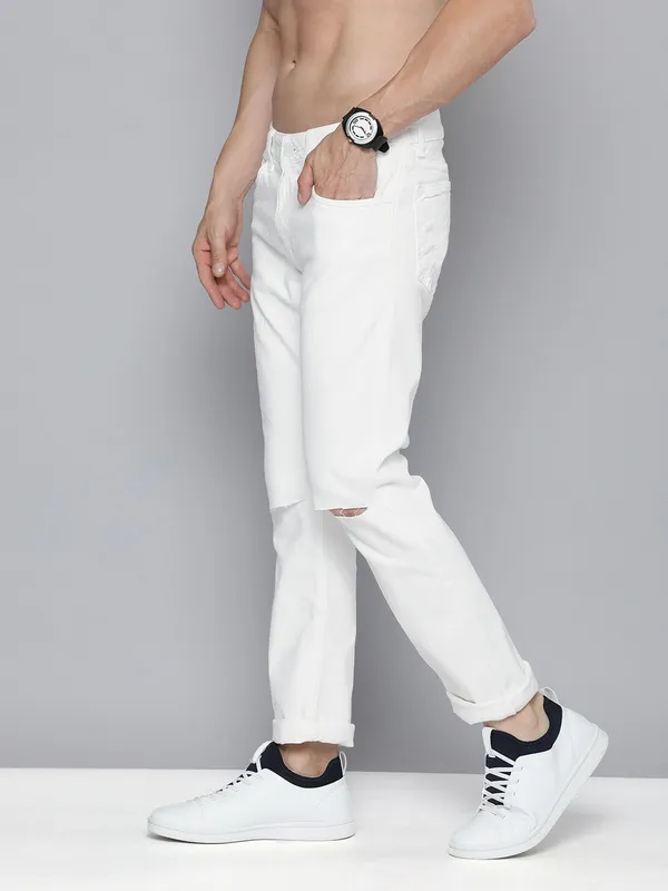 White_Cotton_Blend_Slim_Mid_Rise_Jeans_For_Men