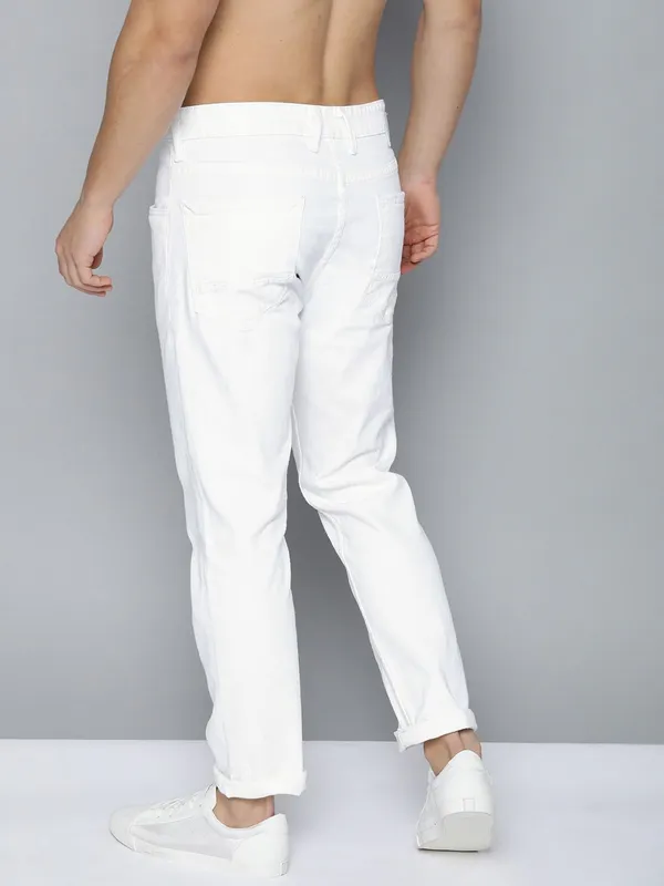 White_Cotton_Blend_Slim_Mid_Rise_Jeans_For_Men