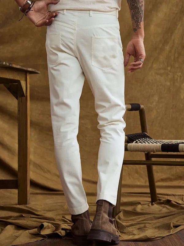 White_Cotton_Blend_Slim_Mid_Rise_Jeans_For_Men