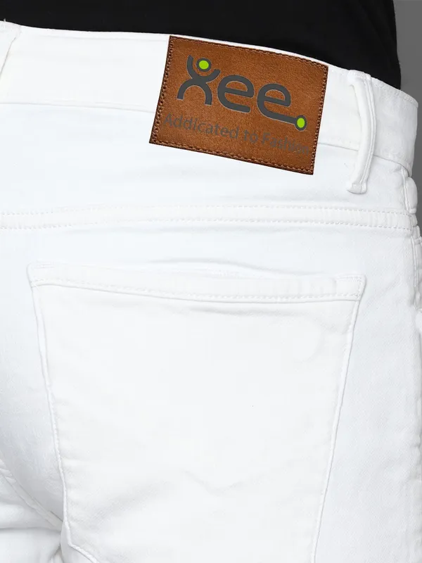 White_Cotton_Blend_Slim_Mid_Rise_Jeans_For_Men