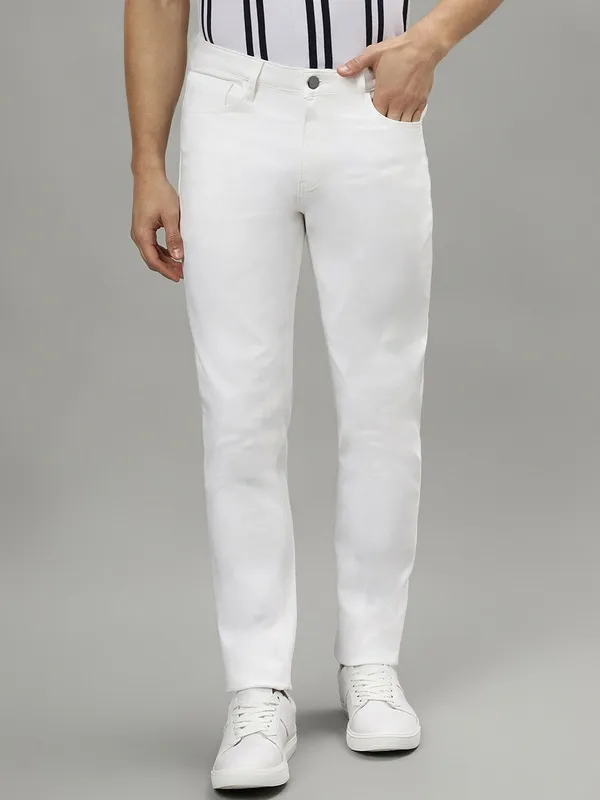 White_Cotton_Blend_Slim_Mid_Rise_Jeans_For_Men