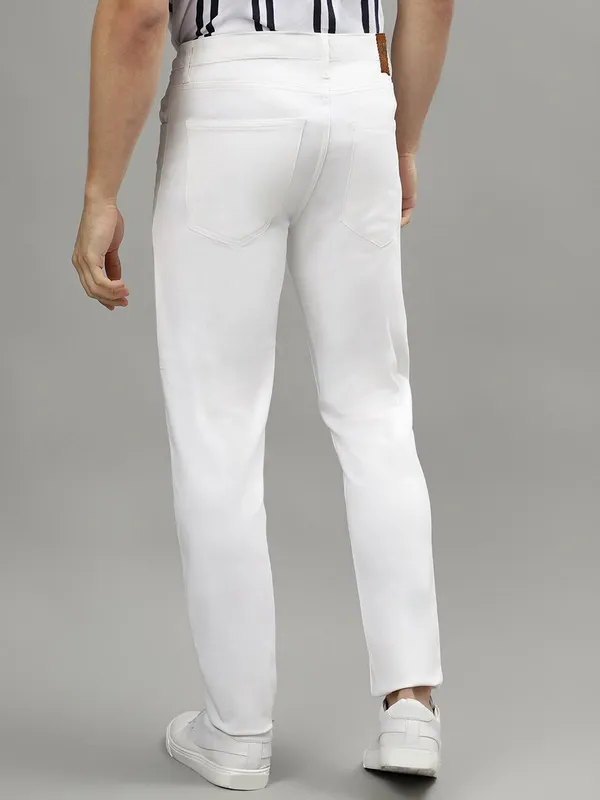 White_Cotton_Blend_Slim_Mid_Rise_Jeans_For_Men