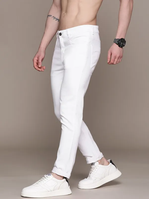 White_Cotton_Blend_Slim_Mid_Rise_Jeans_For_Men