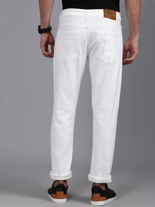 White_Cotton_Blend_Slim_Mid_Rise_Jeans_For_Men
