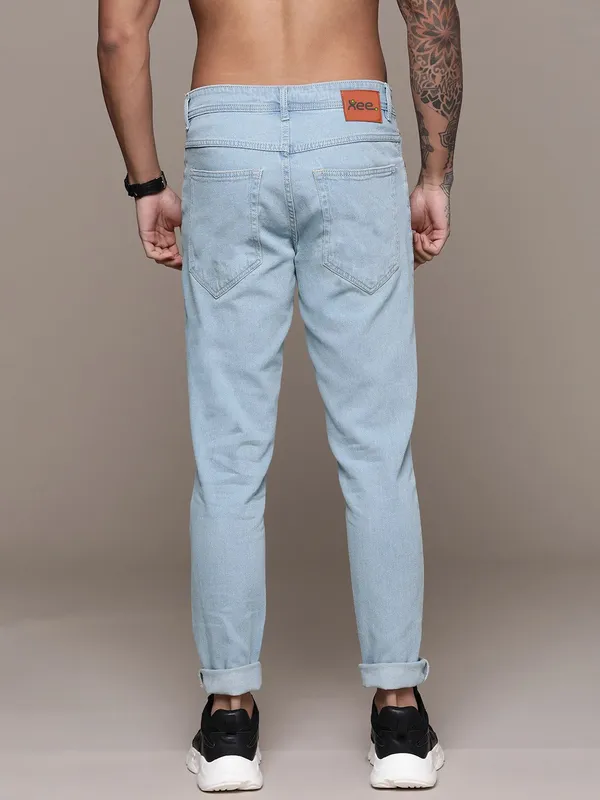 Light_Blue_Cotton_Blend_Slim_Mid_Rise_Jeans_For_Men