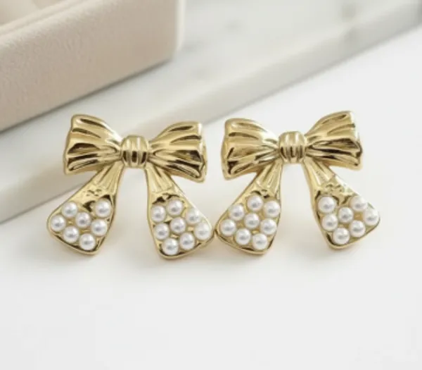 Gold_Pearl_Bow_Earrings_|_Elegant_Luxe_Statement_Design_For_Women