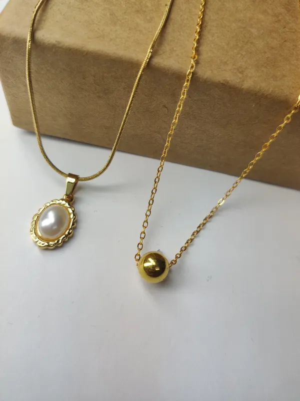 Gold_Brass_Premium_Oval_Pearl_Drop_&_Ball_Pendant_Combo_For_Women_(Pack_Of_2)