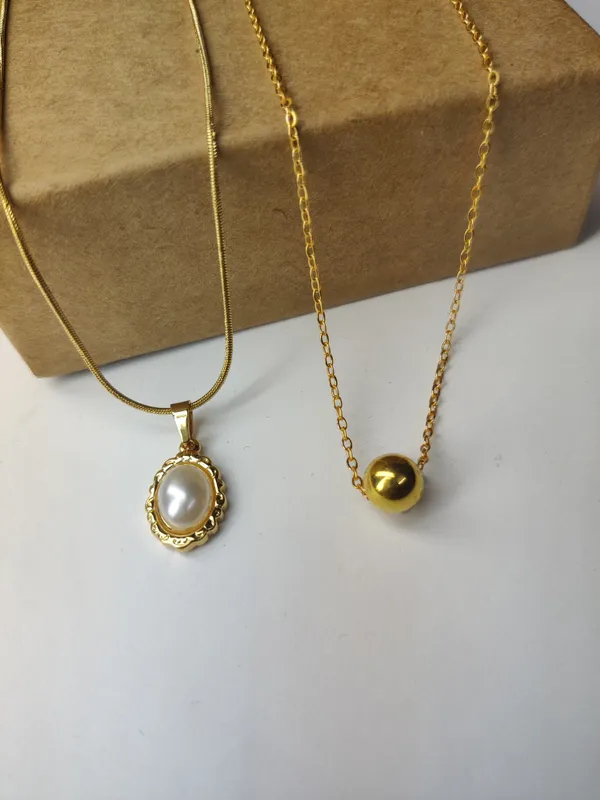 Gold_Brass_Premium_Oval_Pearl_Drop_&_Ball_Pendant_Combo_For_Women_(Pack_Of_2)