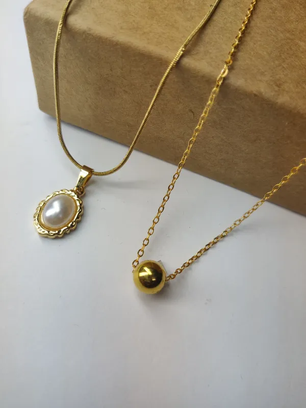 Gold_Brass_Premium_Oval_Pearl_Drop_&_Ball_Pendant_Combo_For_Women_(Pack_Of_2)