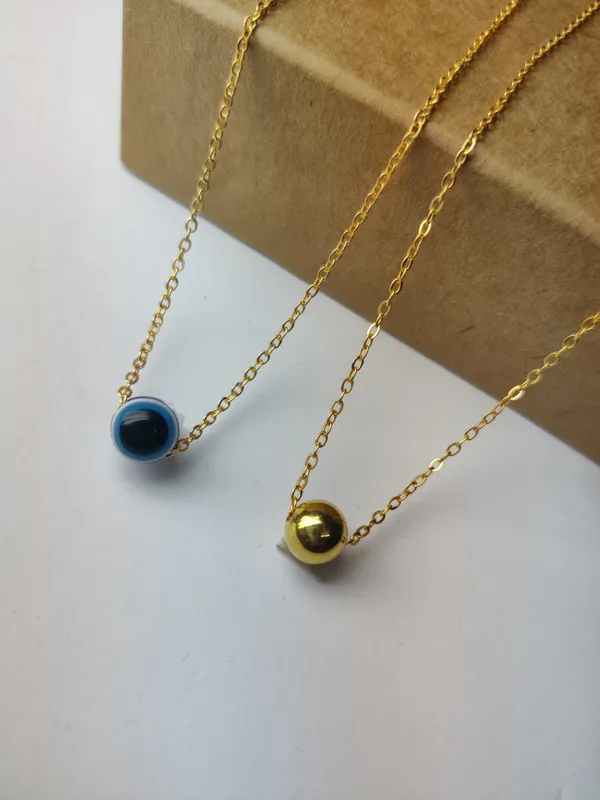 Gold_Brass_Premium_Evil_Eye_&_Plain_Gold_Ball_Pendant_Combo_For_Women_(Pack_Of_2)